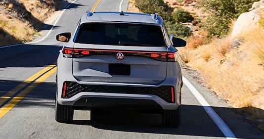 2025 VW Tiguan moving, rear view with taillights on.