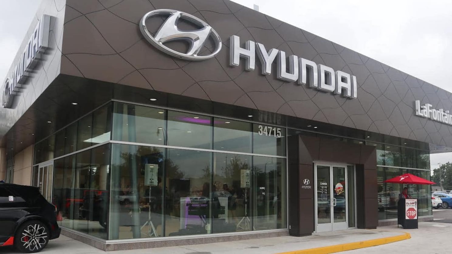 A Hyundai dealership is seen on a cloudy day.