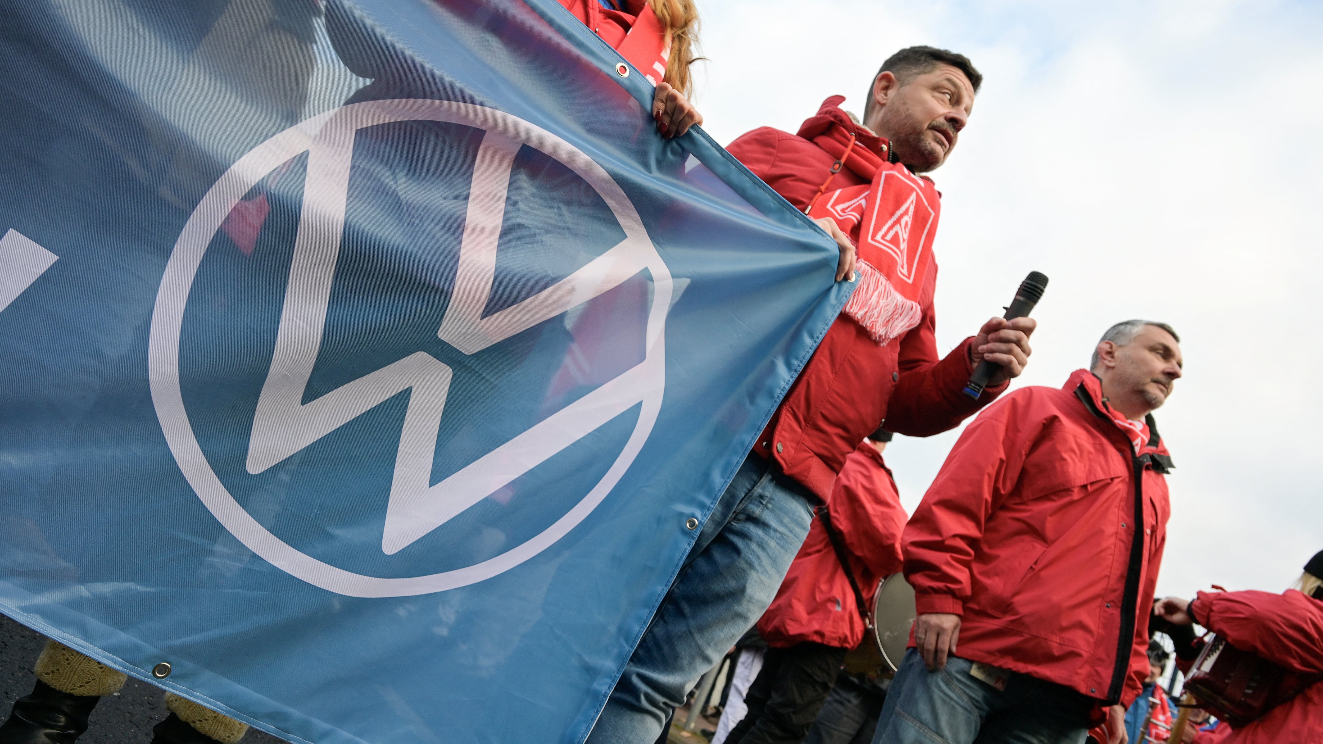 VW workers gather in Hanover to strike against planned cuts to wages and possible factory closures.